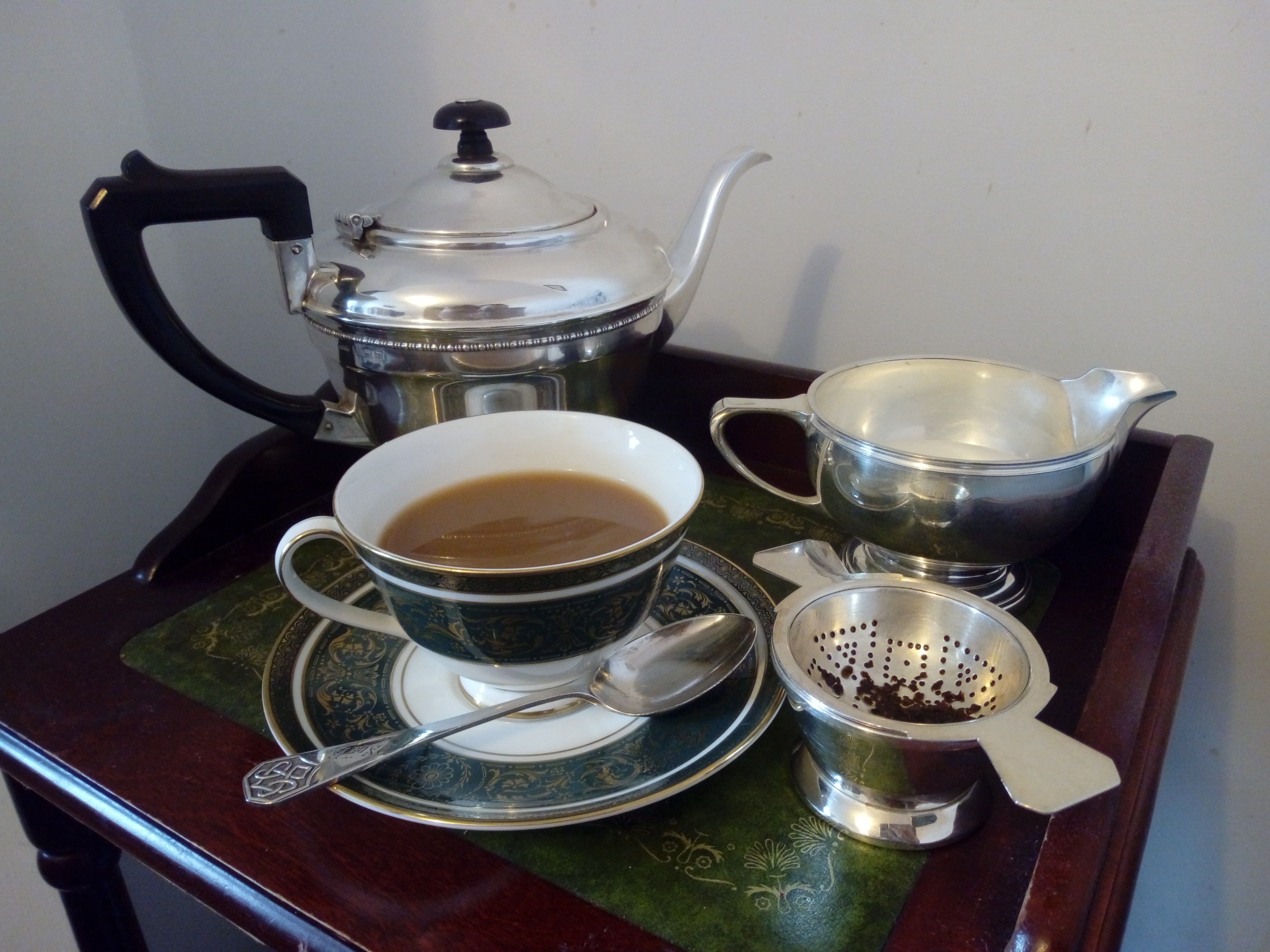 Classic afternoon tea table with fine bone china and tea service